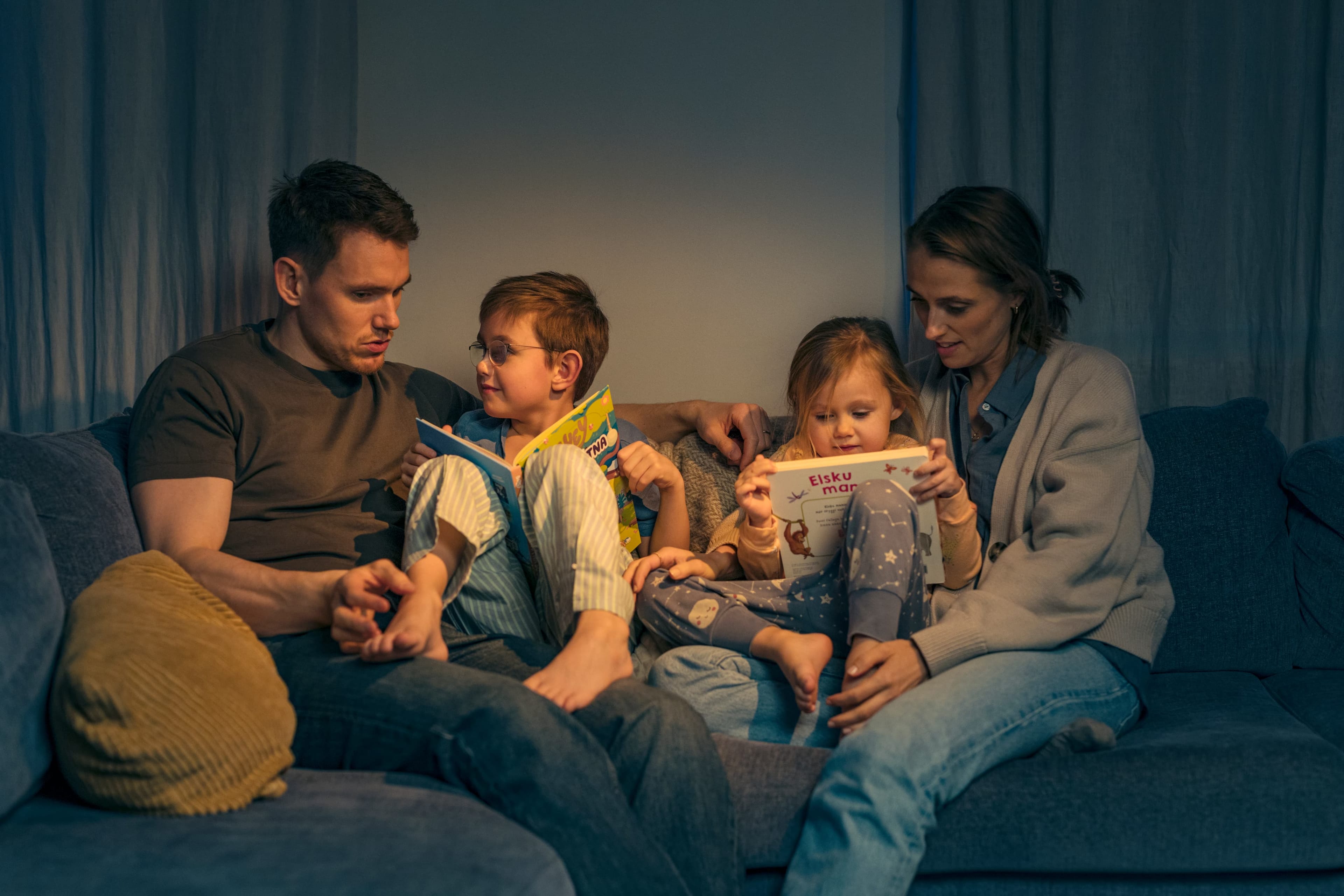 Family reading on the couch